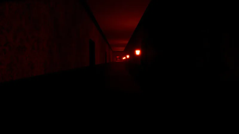 A long, dark, ominous hallway illuminated only by red wall sconces